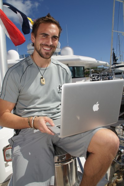 Megayacht Crewmember on his computer - Internet Job Hunt