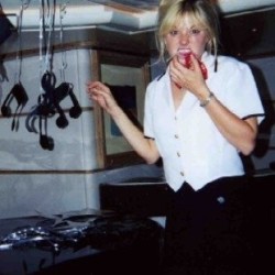 Julie Perry in her days as a yacht stewardess, decorating for a theme party for charter guests.