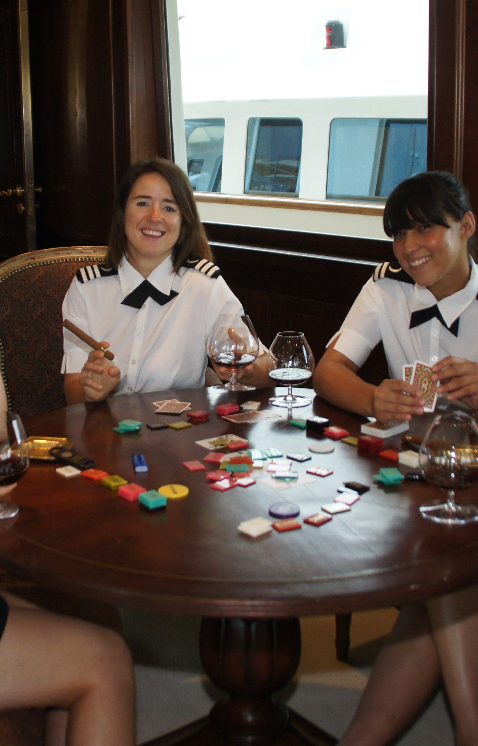 Stewardesses on M/Y "Big Aron" taking a break onboard. Photo by Suki Finnerty of YachtingToday.TV