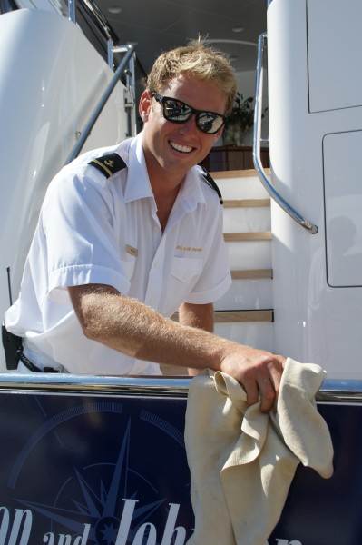 Megayacht Deckhand Polishes the Rails