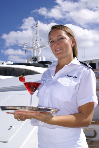 Yacht Stewardess Serves Drink