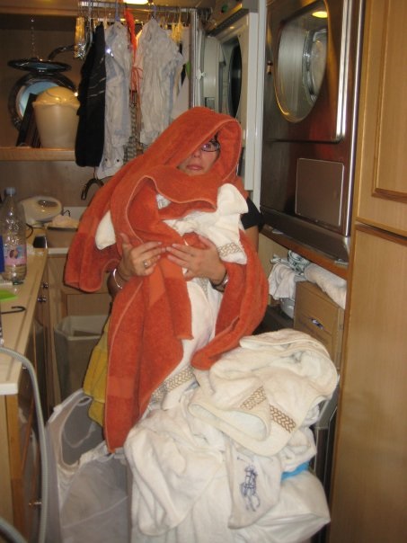 A Yacht Stewardess working in the Laundry Room